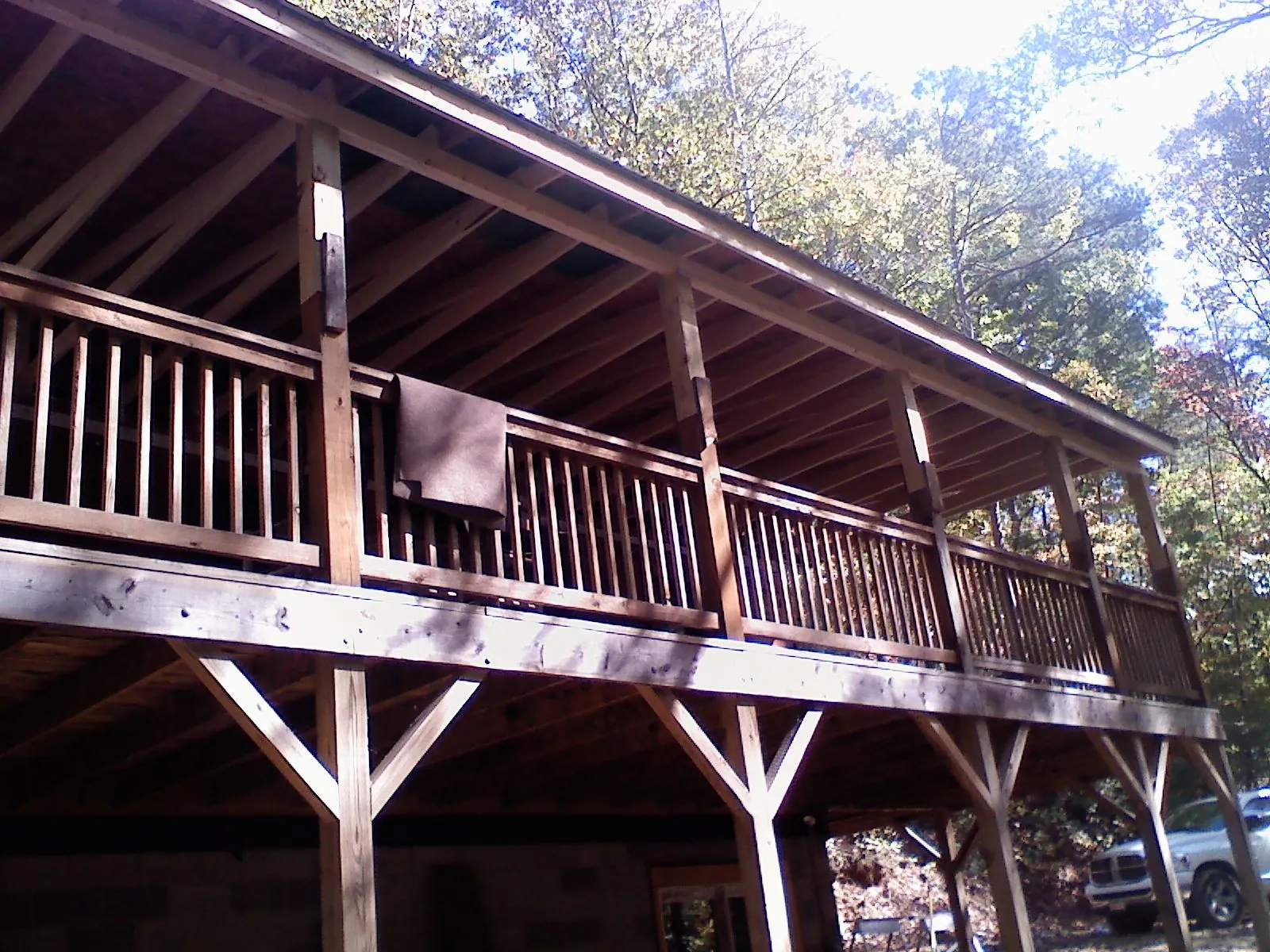 Timber framing under a new elevated porch and deck — Roof Leak Repair in Morehead City by Roofing Brothers